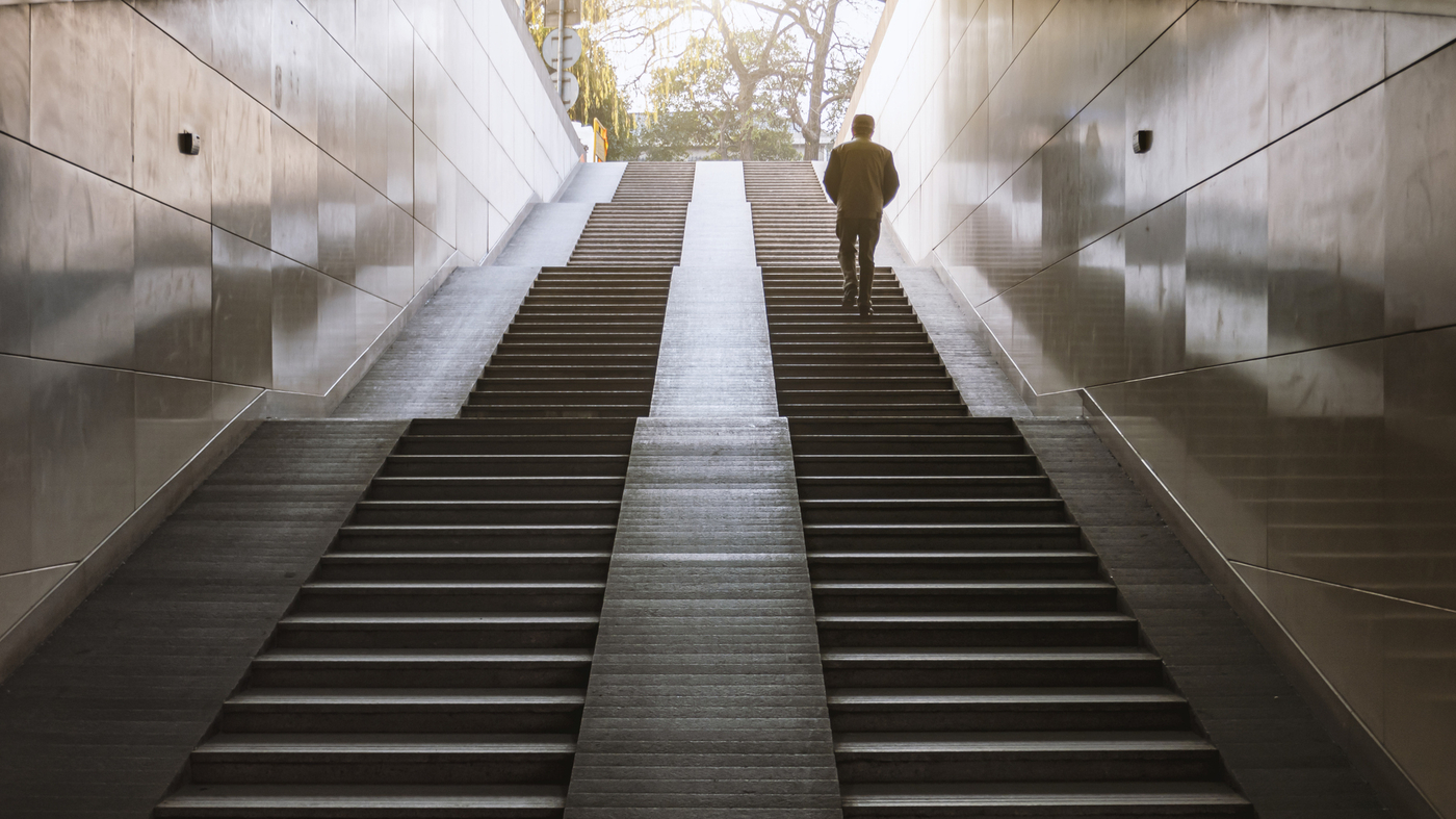 People taking the stairs to increase NEAT and overcome a weight loss stall.